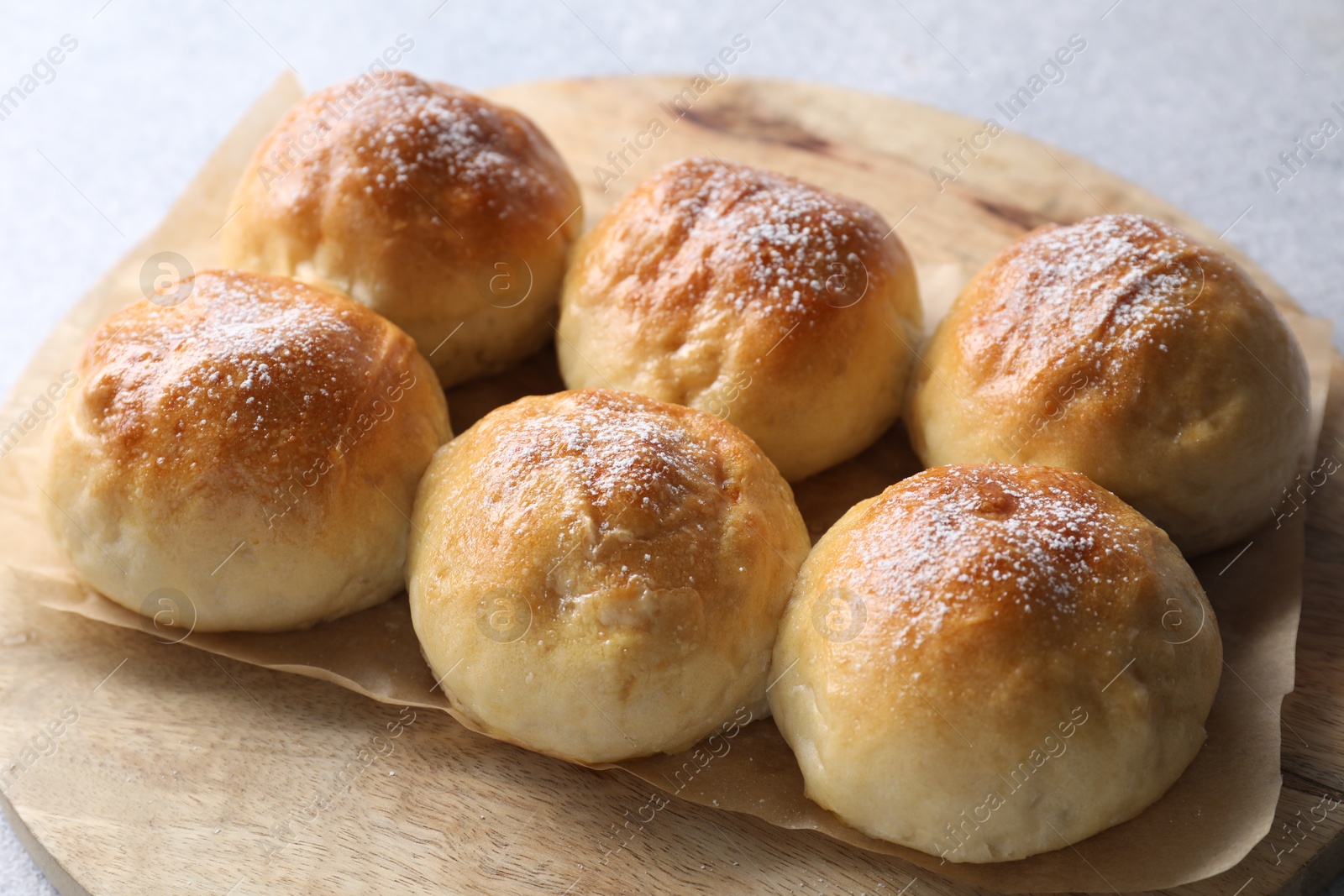 Photo of Delicious dough balls on grey table, closeup