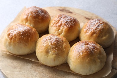 Photo of Delicious dough balls on grey table, closeup