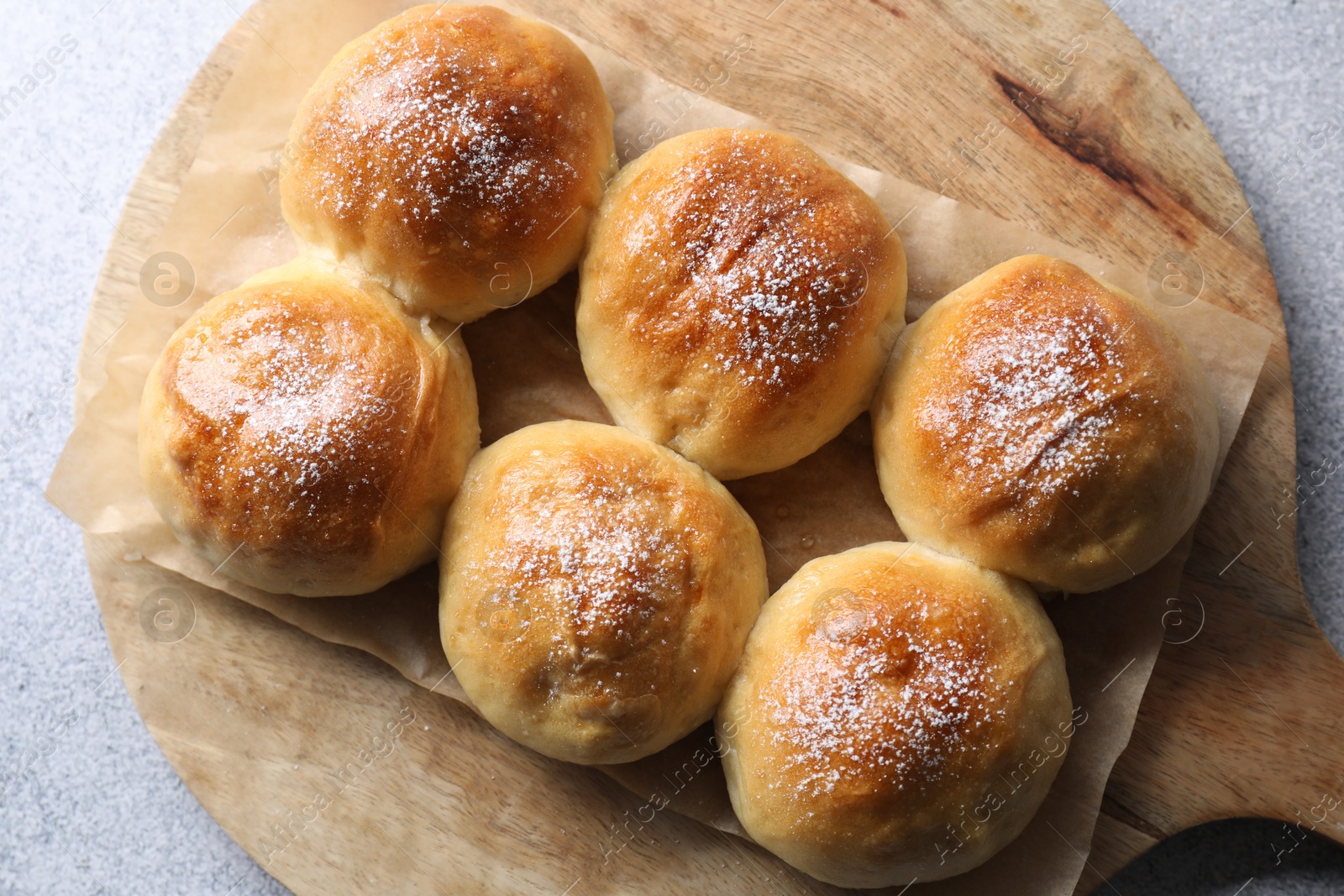 Photo of Delicious dough balls on grey table, top view