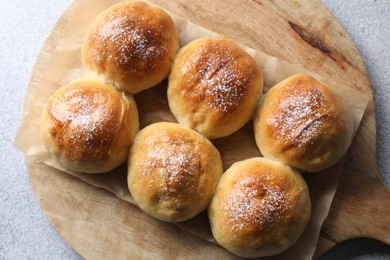 Photo of Delicious dough balls on grey table, top view