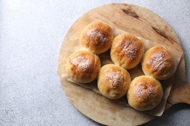 Delicious dough balls on grey table, top view