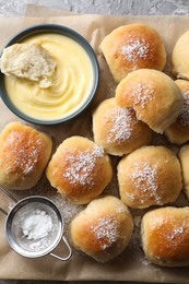 Delicious dough balls and sauce on table, top view