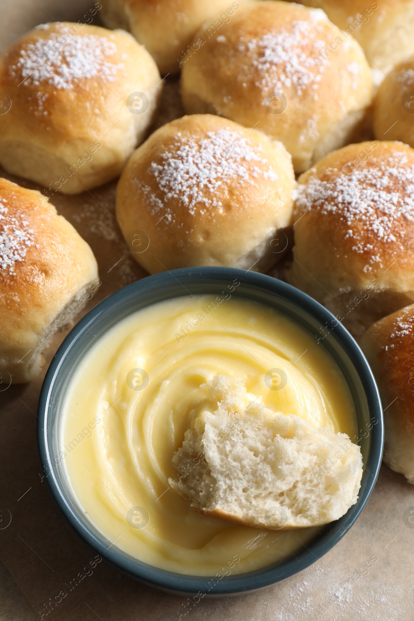 Photo of Delicious dough balls with sauce on table, closeup