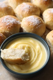 Photo of Delicious dough balls with sauce on table, closeup