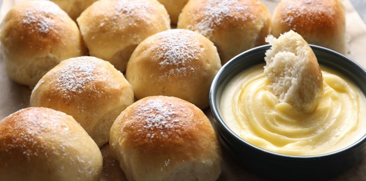 Delicious dough balls with sauce on table, closeup