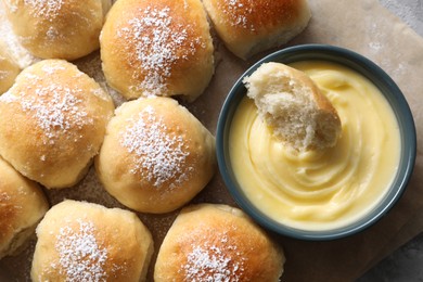 Photo of Delicious dough balls and sauce on table, top view