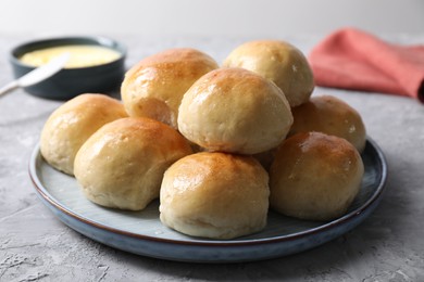 Delicious dough balls on grey table, closeup