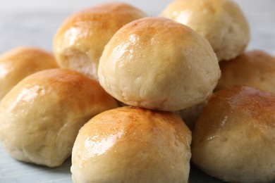 Delicious dough balls on table, closeup view