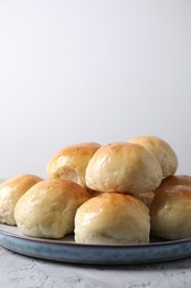 Delicious dough balls on grey table, closeup. Space for text