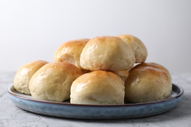 Photo of Delicious dough balls on grey table, closeup