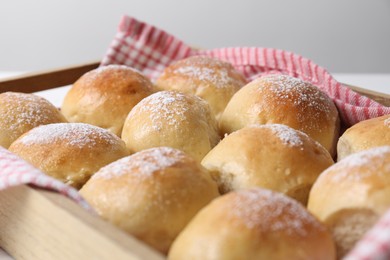 Delicious dough balls in wooden crate, closeup