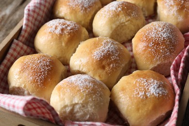 Delicious dough balls in wooden crate, closeup