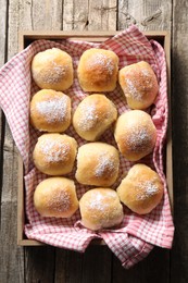 Photo of Delicious dough balls on wooden table, top view