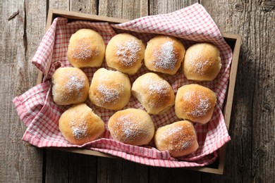 Photo of Delicious dough balls on wooden table, top view