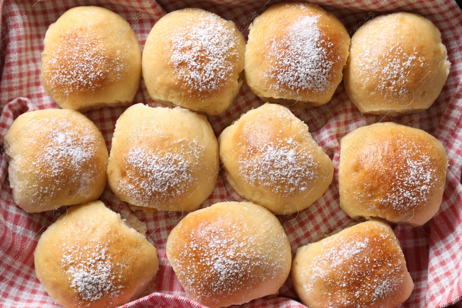 Photo of Delicious dough balls on towel, top view