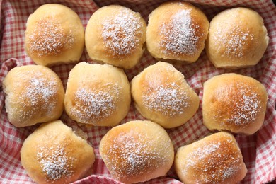 Delicious dough balls on towel, top view