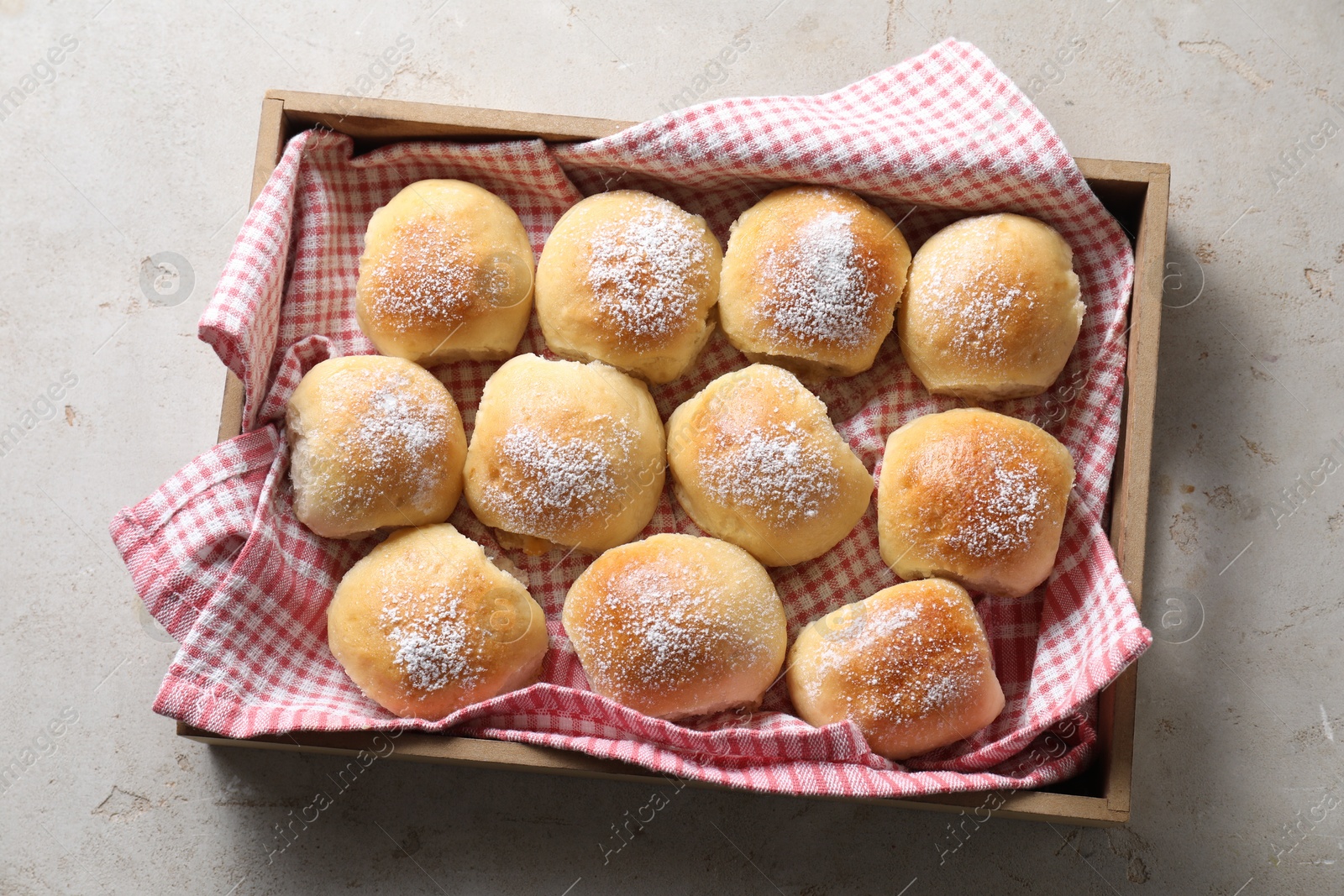 Photo of Delicious dough balls on light table, top view