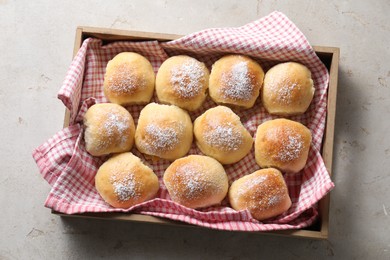 Delicious dough balls on light table, top view