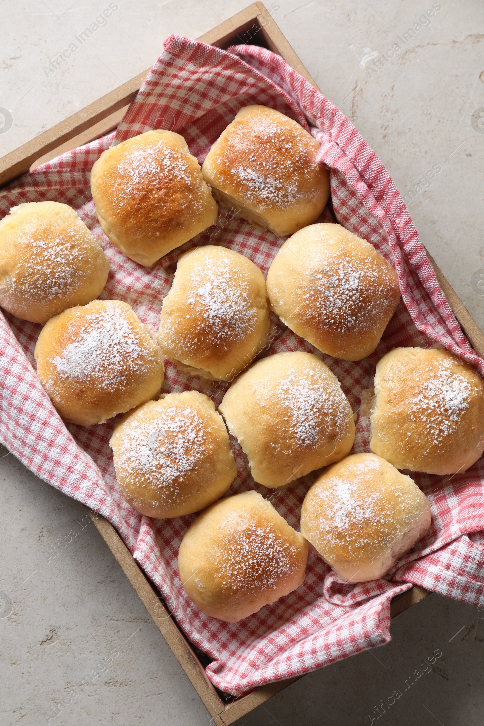 Photo of Delicious dough balls on light table, top view