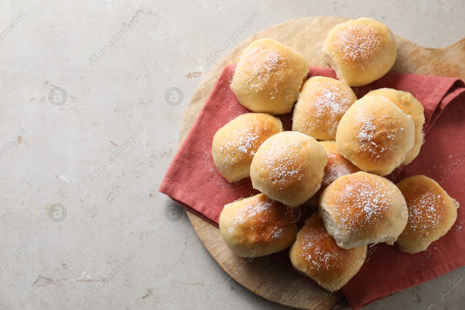 Photo of Delicious dough balls on light table, top view. Space for text