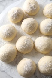 Raw dough balls on table, top view