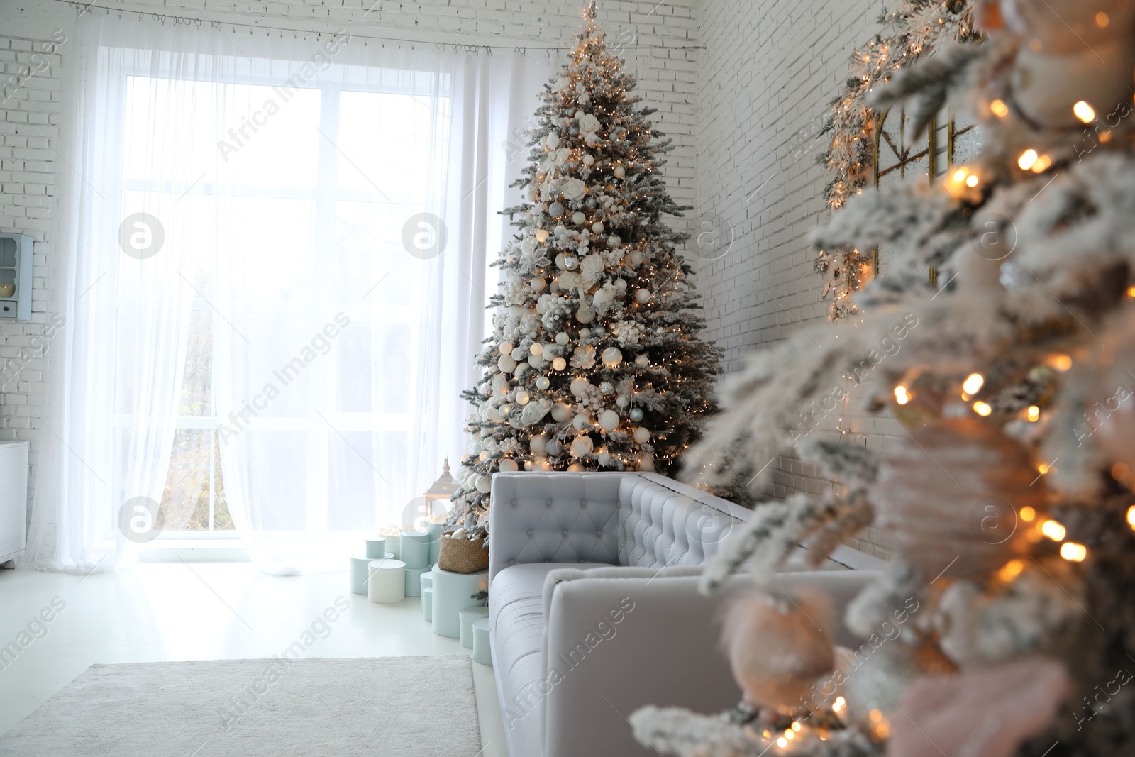 Photo of Beautiful interior of living room with decorated Christmas trees