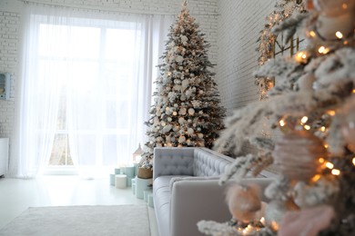 Photo of Beautiful interior of living room with decorated Christmas trees