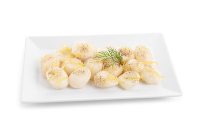 Raw scallops with milled pepper, dill and lemon zest isolated on white