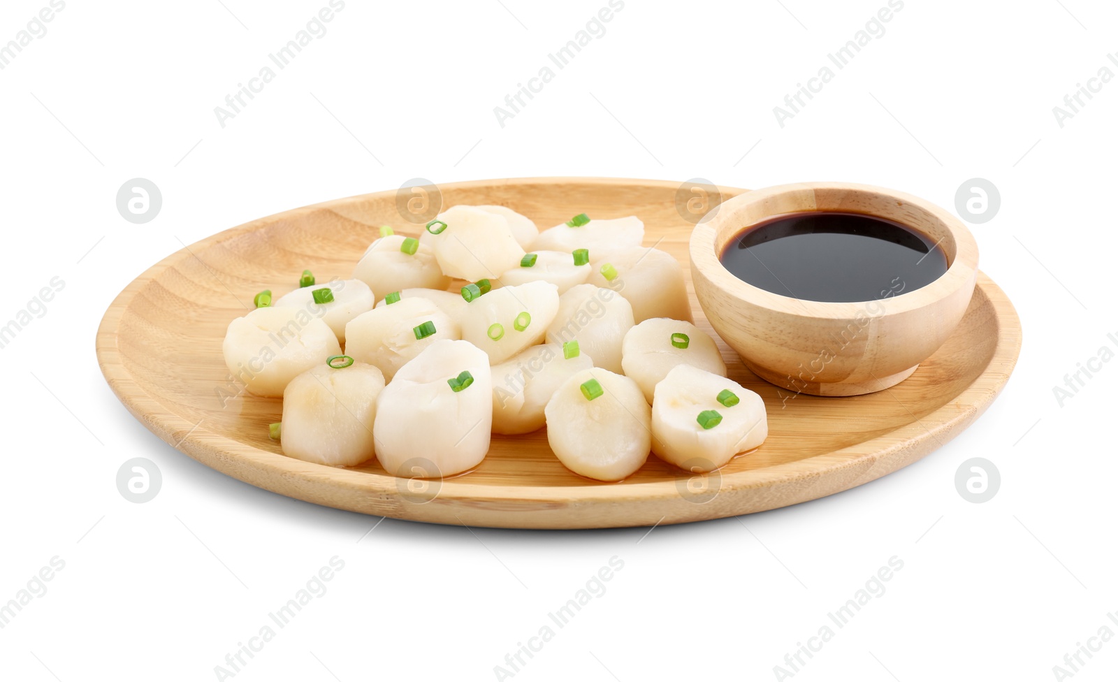 Photo of Raw scallops with green onion and soy sauce isolated on white