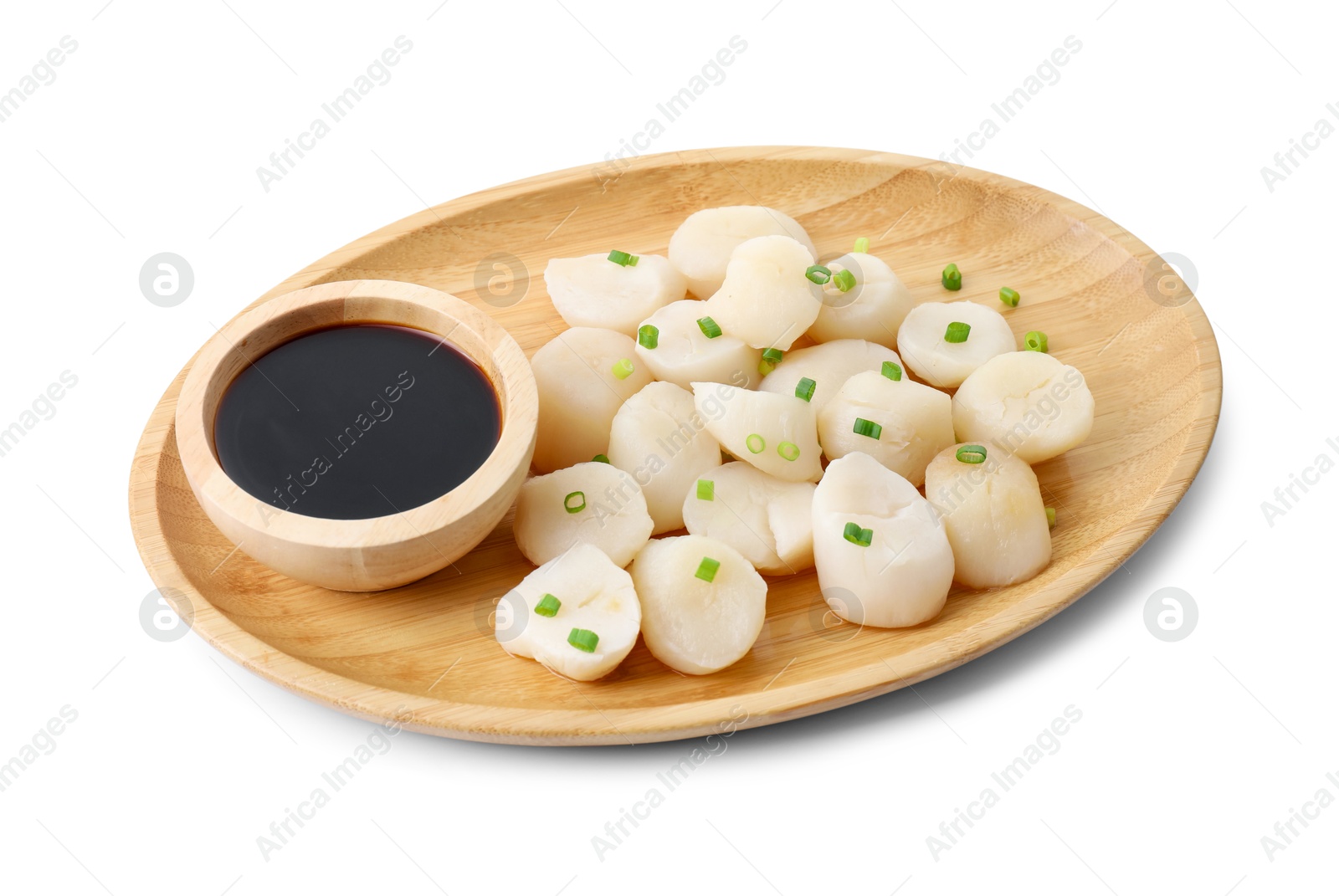 Photo of Raw scallops with green onion and soy sauce isolated on white