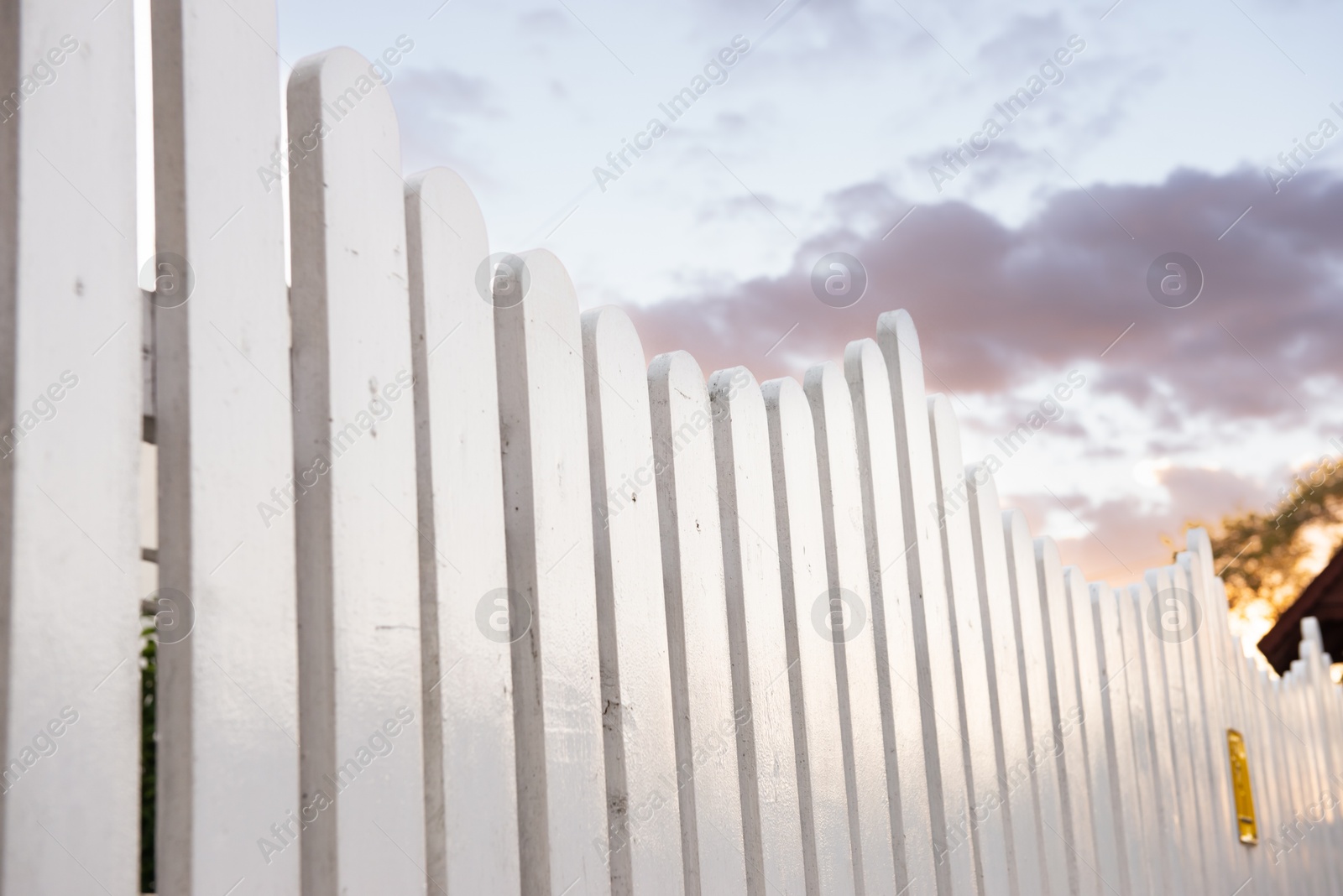 Photo of Beautiful white wooden fence against sky outdoors