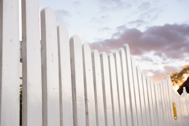 Photo of Beautiful white wooden fence against sky outdoors