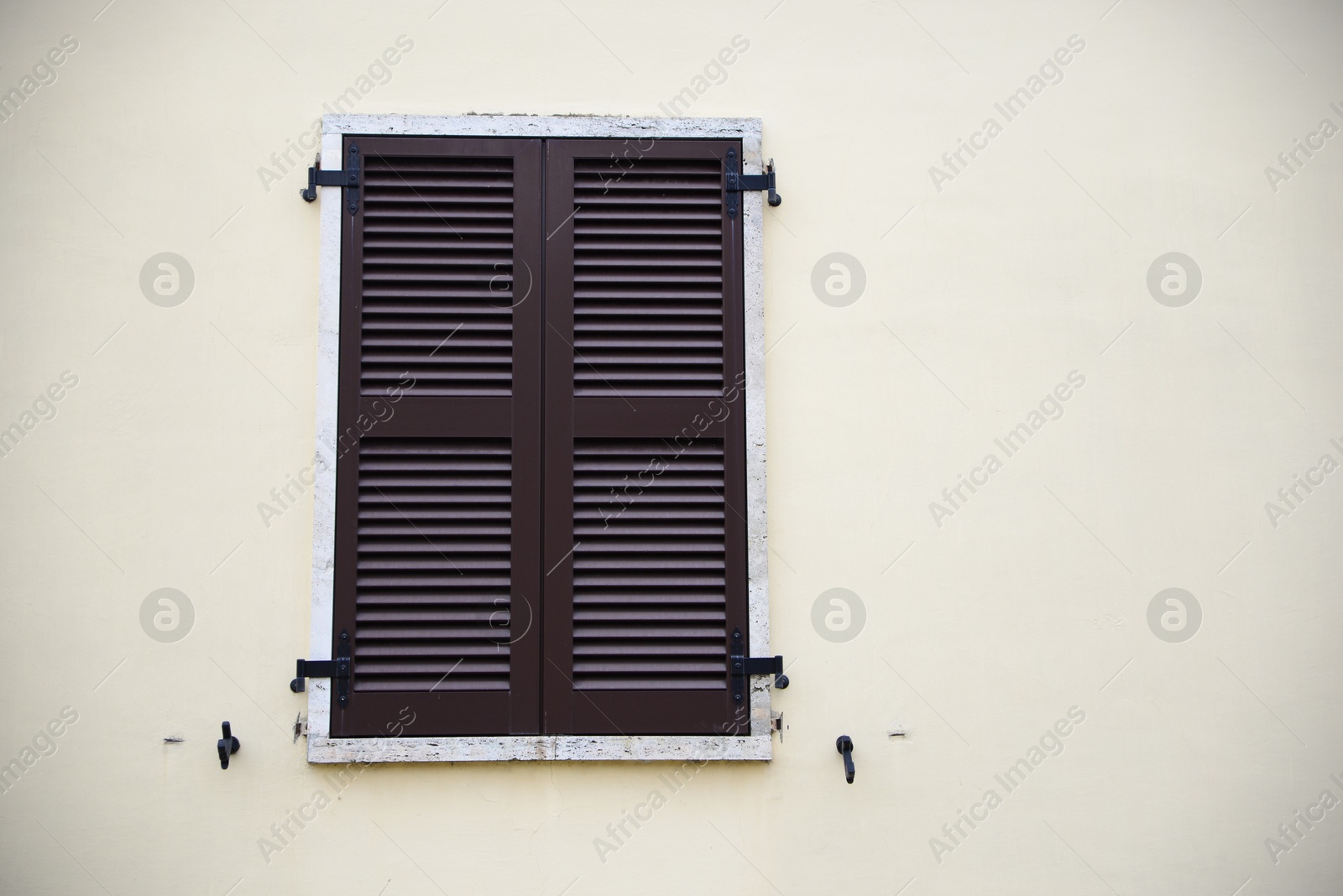 Photo of Beautiful building with window and wooden shutter