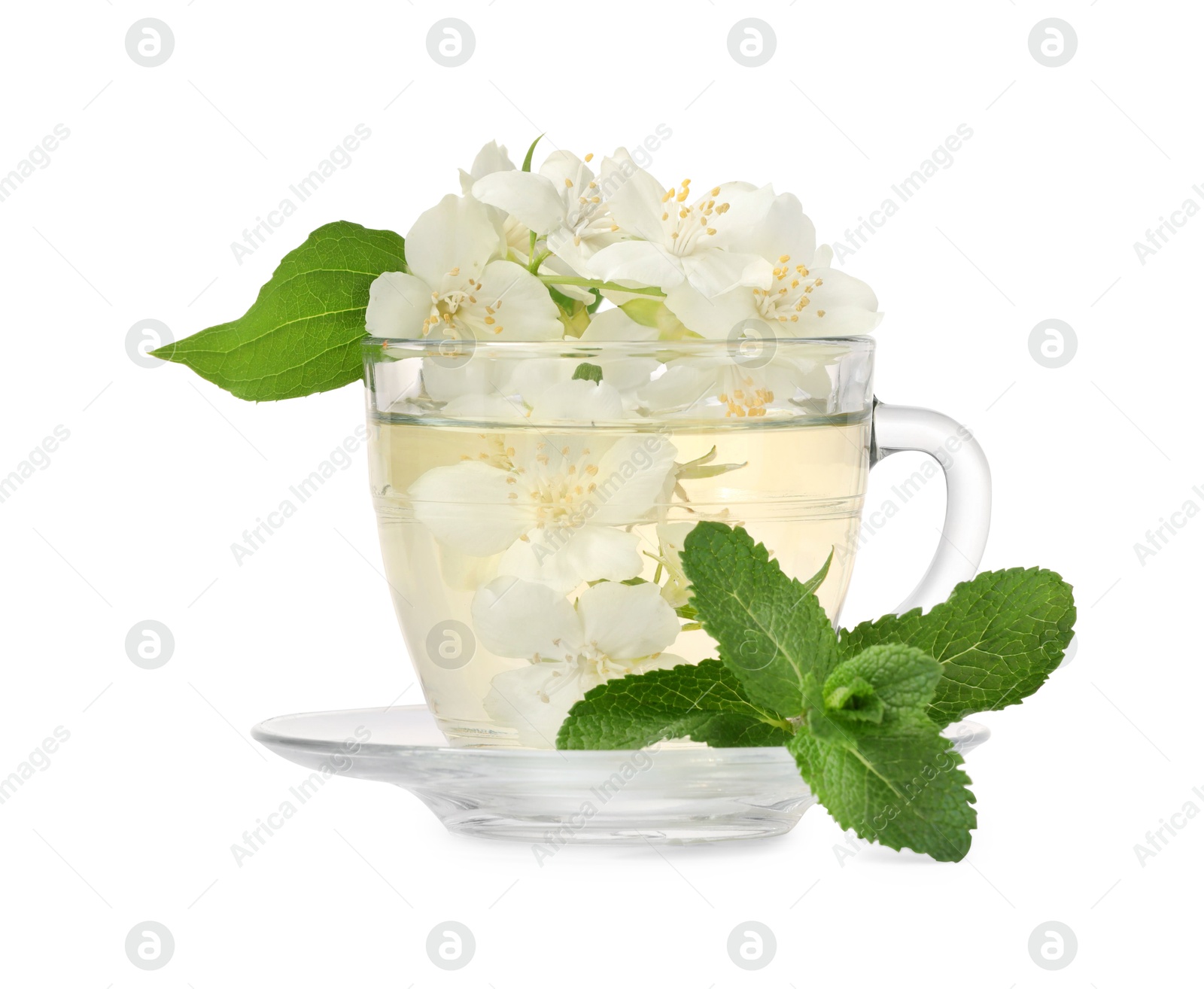 Photo of Aromatic herbal tea in glass cup with mint and jasmine flowers isolated on white