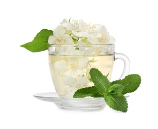 Photo of Aromatic herbal tea in glass cup with mint and jasmine flowers isolated on white