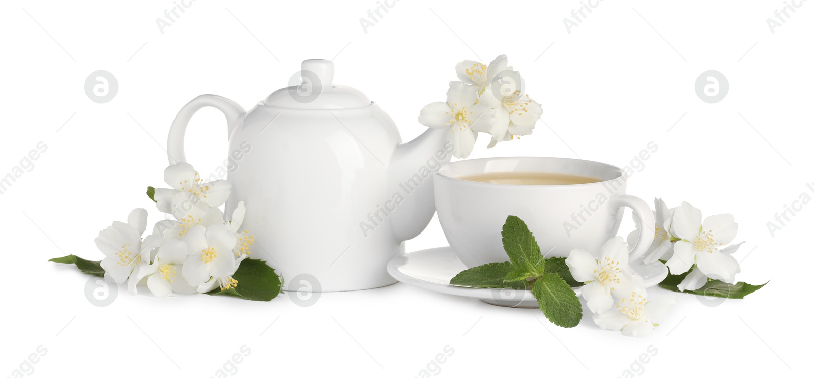 Photo of Aromatic herbal tea with mint and jasmine flowers isolated on white