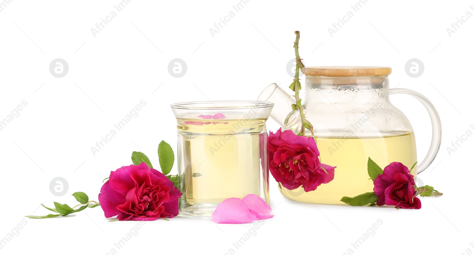 Photo of Aromatic herbal tea with rose flowers isolated on white