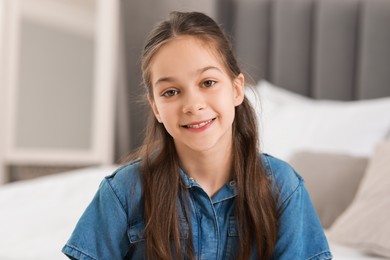 Portrait of happy little girl indoors. Cute child