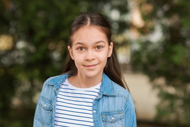 Photo of Portrait of beautiful little girl outdoors. Cute child