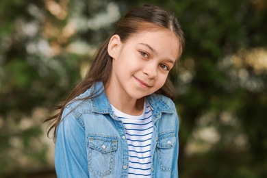 Photo of Portrait of beautiful little girl outdoors. Cute child