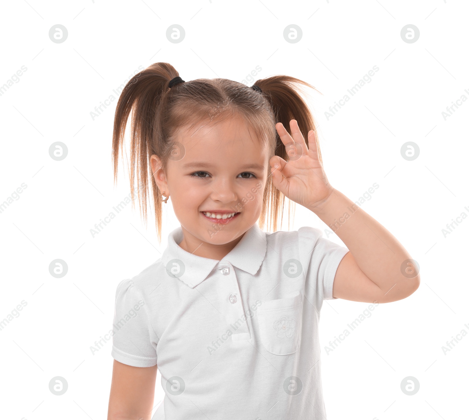 Photo of Portrait of happy little girl showing OK gesture on white background