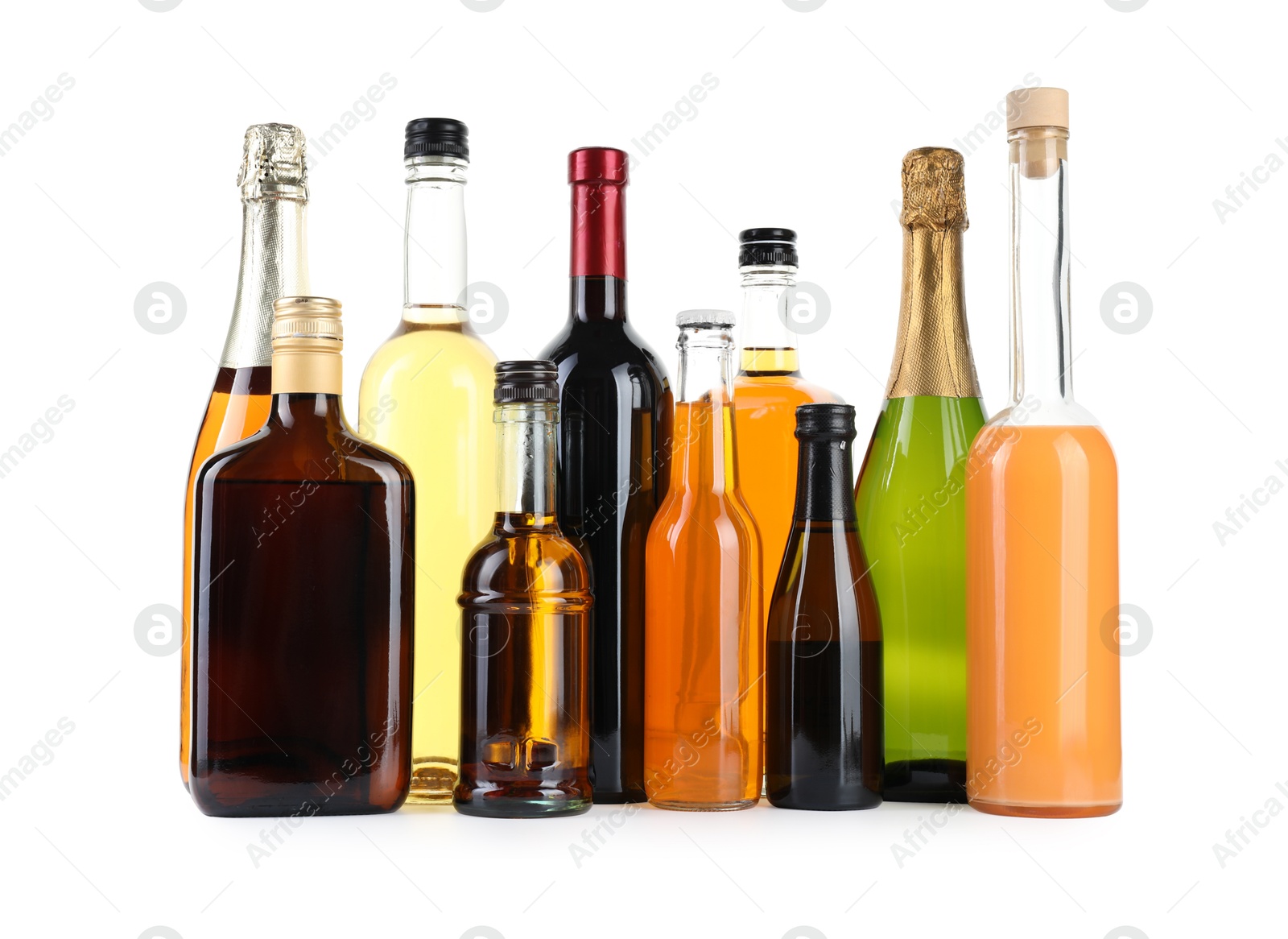 Photo of Bottles of different alcoholic drinks isolated on white