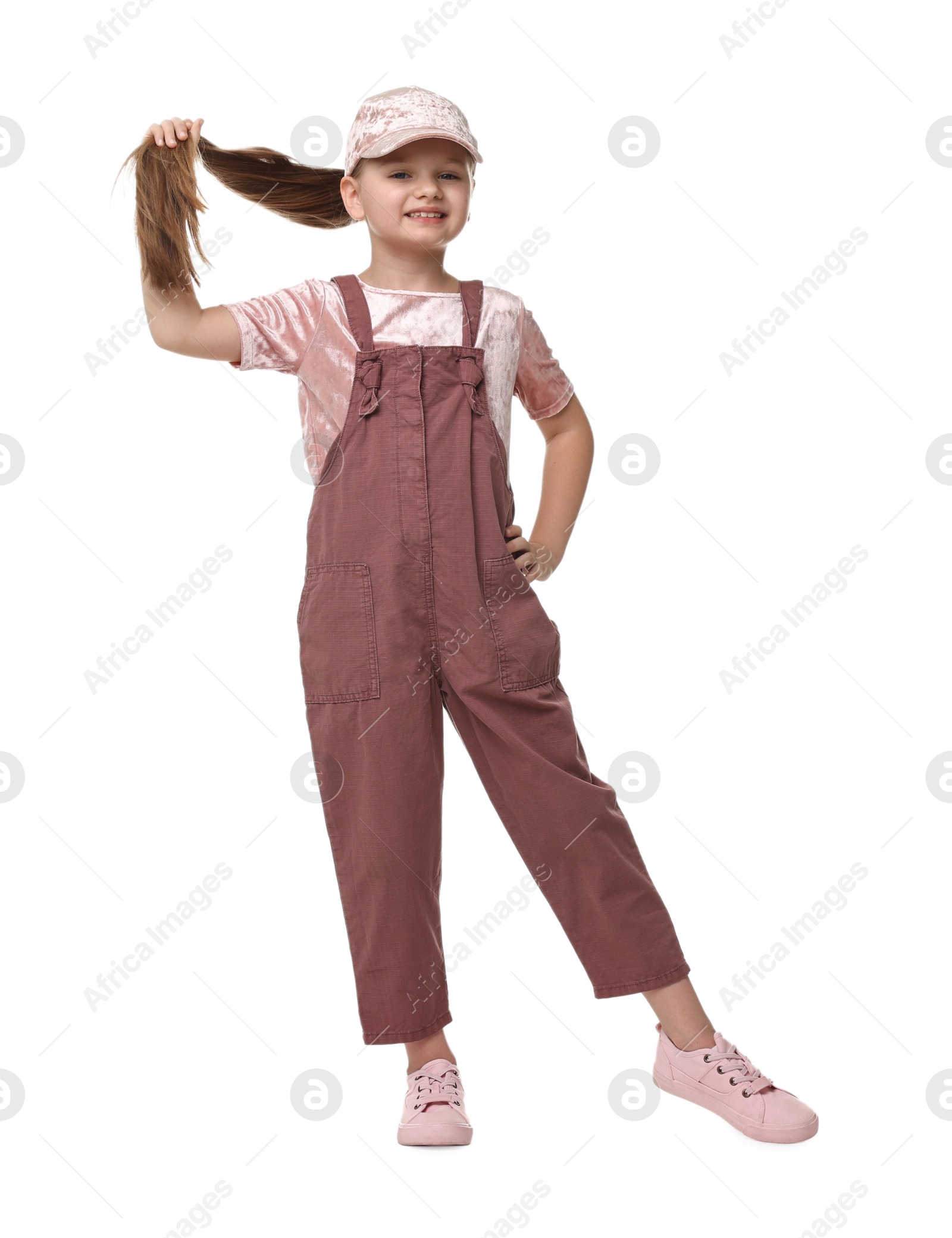 Photo of Cute little girl dancing on white background