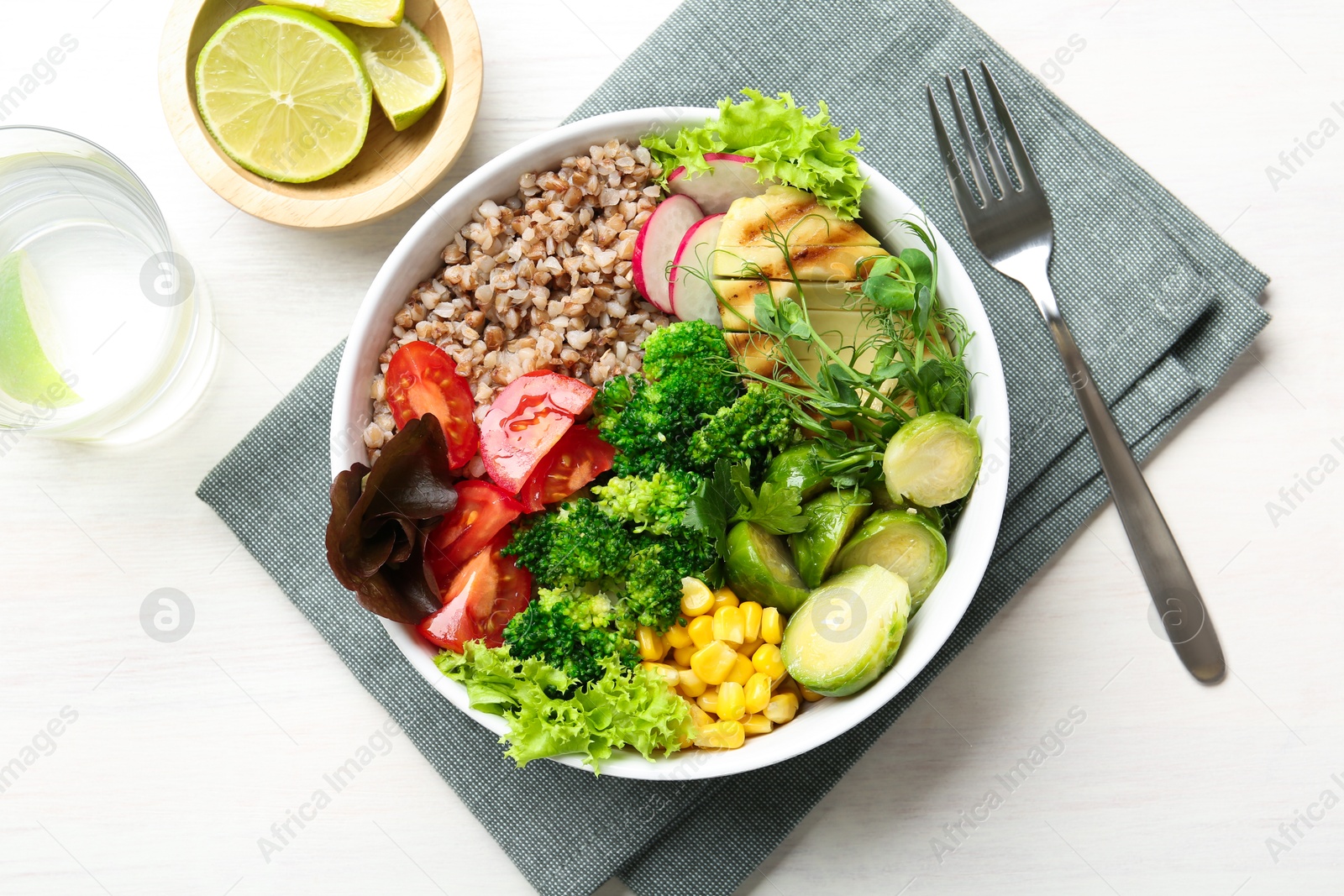 Photo of Healthy meal. Tasty products in bowl on white table, top view