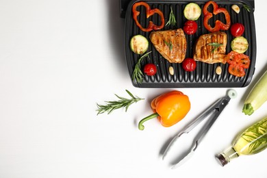 Photo of Flat lay composition with electric grill and different products on white table