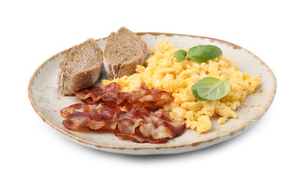 Photo of Delicious scrambled eggs with bacon and basil in plate isolated on white