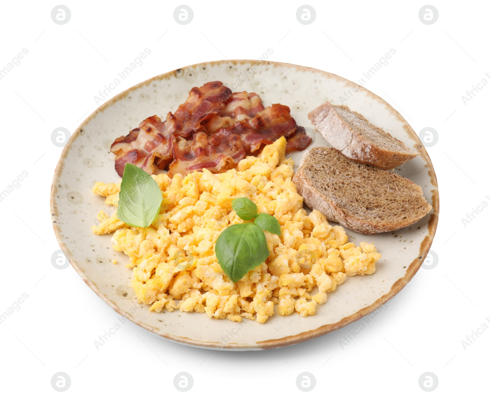 Photo of Delicious scrambled eggs with bacon and basil in plate isolated on white