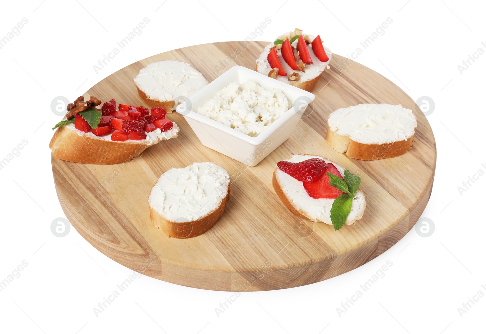 Photo of Board with different tasty ricotta bruschettas isolated on white