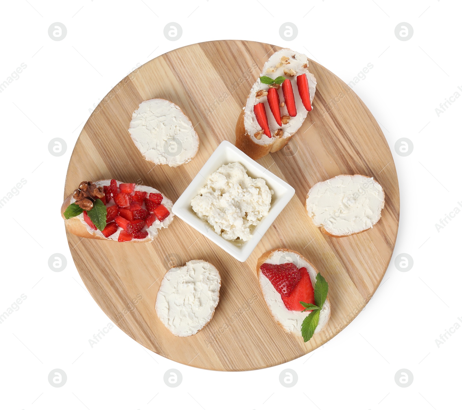 Photo of Board with different tasty ricotta bruschettas isolated on white, top view