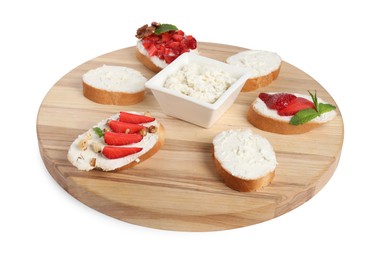 Photo of Board with different tasty ricotta bruschettas isolated on white